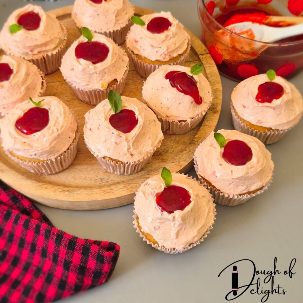 strawberry compote filled top of cupcakes