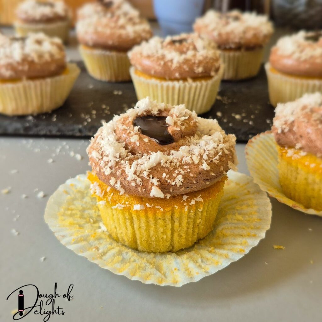 soft coconut cupcakes with creamy chocolate filling