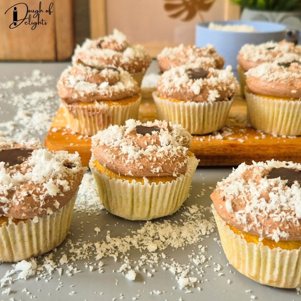 soft coconut cupcakes with creamy chocolate  custard filling