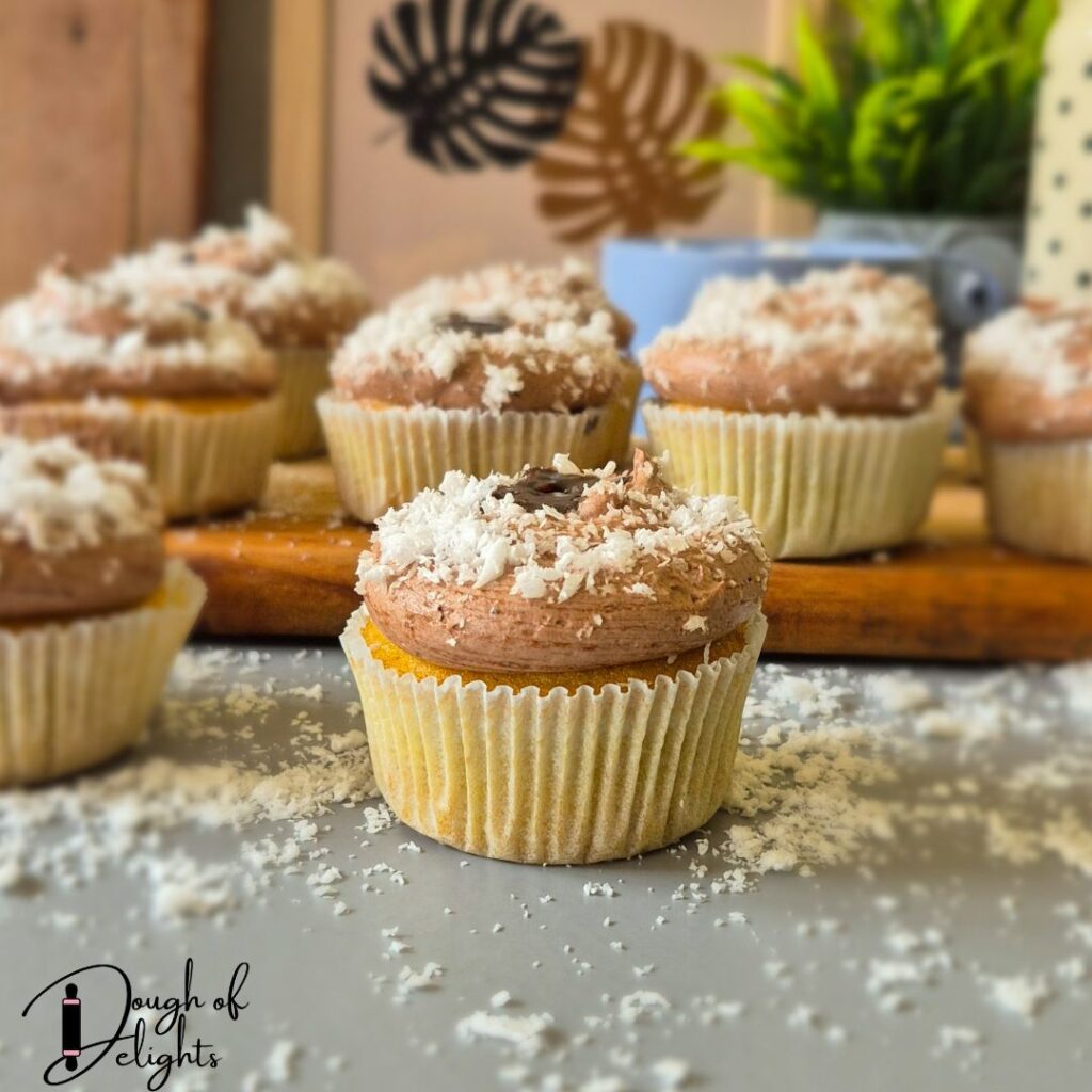 soft coconut cupcake with creamy chocolate custard filling
