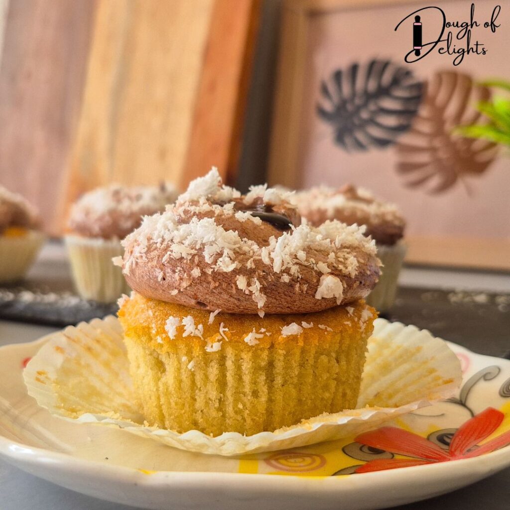 coconut cupcake with chocolate custard filling