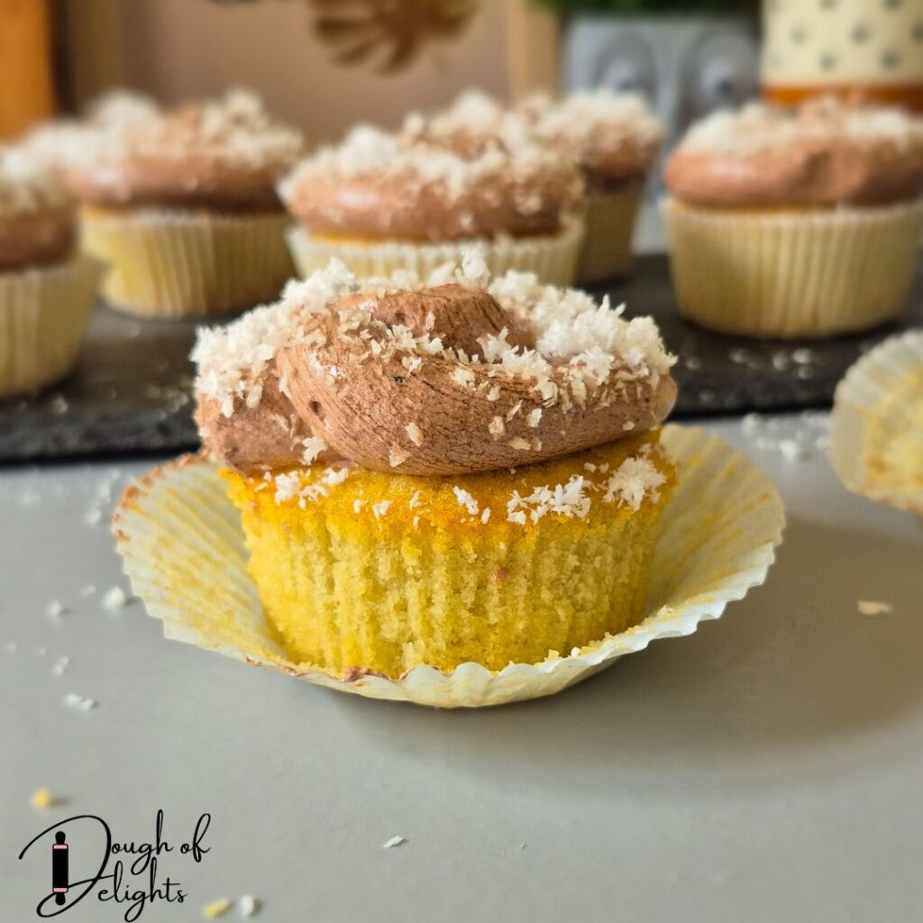 coconut cupcakes with chocolate custard filling