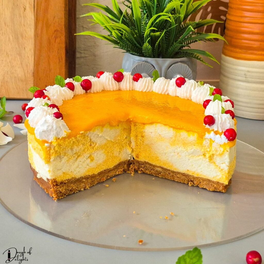 Homemade mango coconut cheesecake with a marbled mango filling
