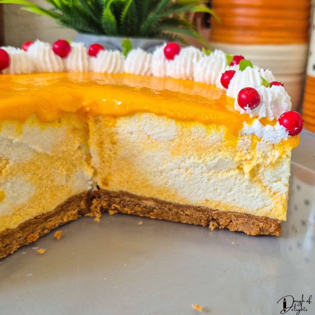 Homemade eggless mango coconut cheesecake with a marbled mango filling