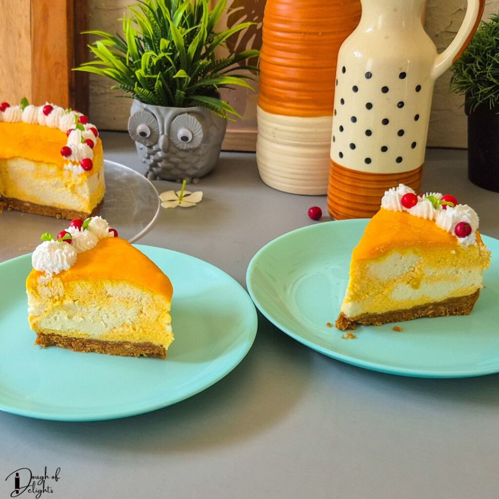 Creamy coconut mango cheesecake slice topped with whipped cream and fresh fruit