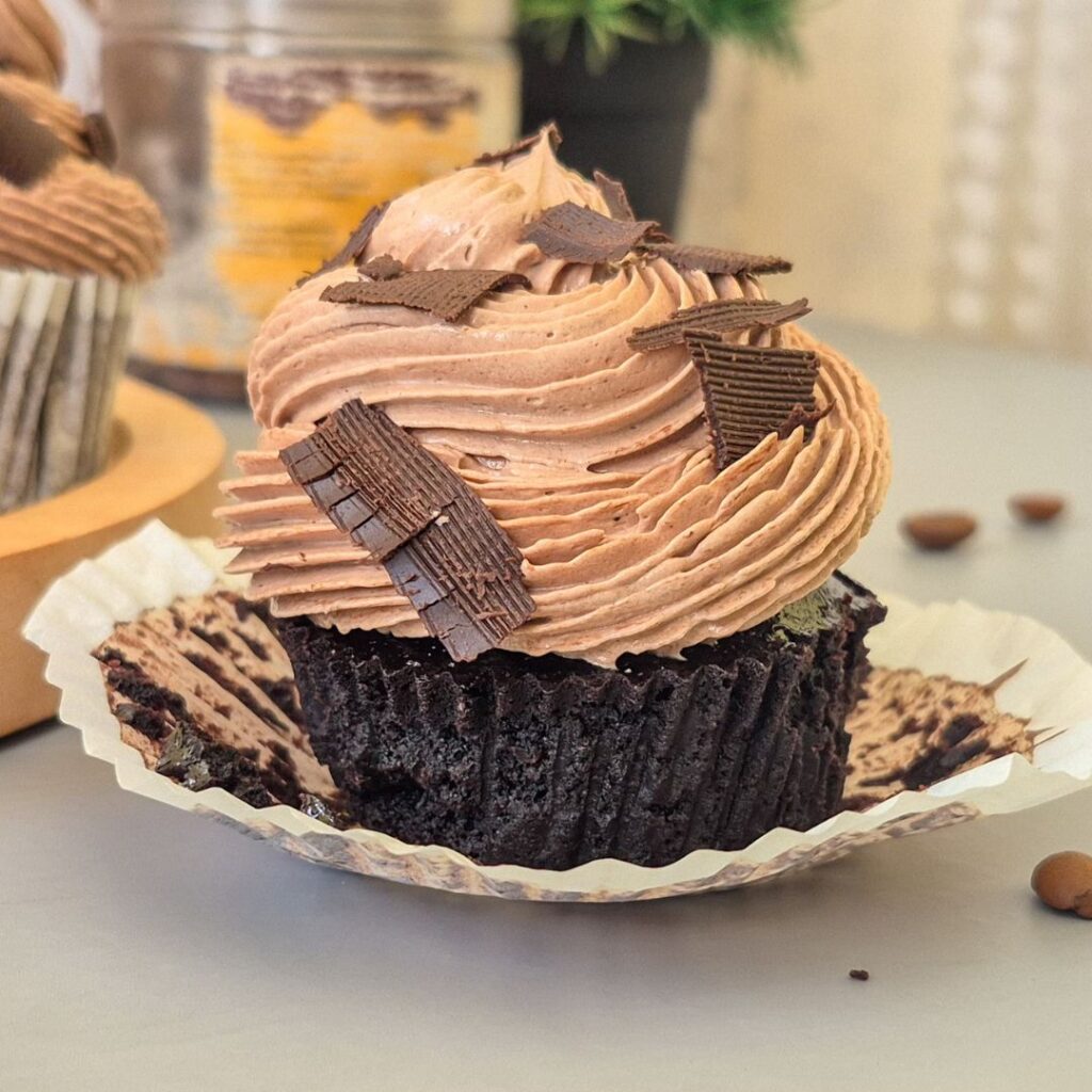 chocolate cupcake with mocha swiss meringue buttercream with chocolate shavings