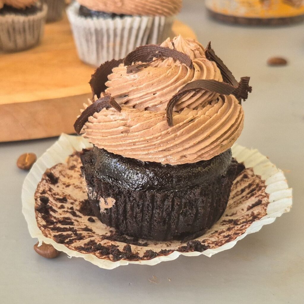 chocolate cupcake with mocha swiss meringue buttercream with dark chocolate curls